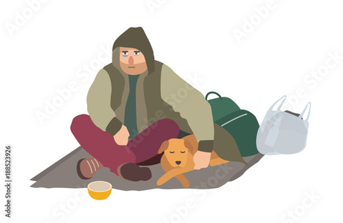 Depressed homeless guy dressed in dirty clothes sitting on carton mat on street, embracing sleeping dog and begging for money