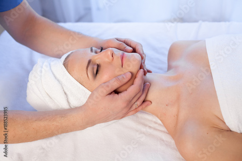 girl masseur doing massage in spa health photo