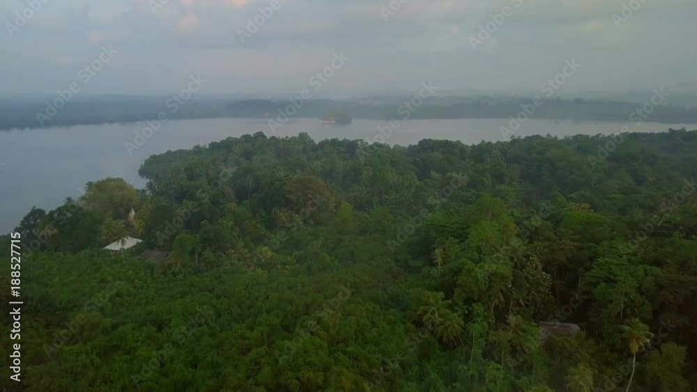 Aerial view of foggy tropic green island at sunrise on ceylon drone footage Aerial view of foggy tropic green island at sunrise on ceylon drone footage
