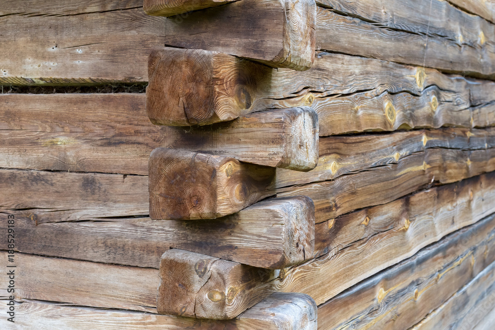 Wood corner of a old building with dovetail joints Wood corner of a old building with dovetail joints
