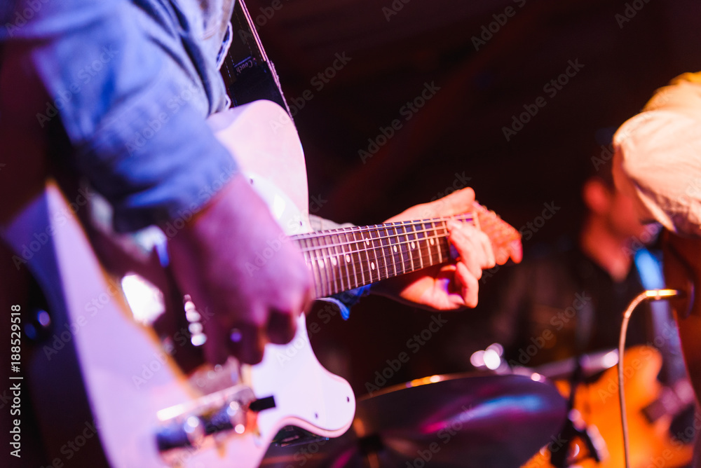 Obraz premium Close up of guitarist playing during concert