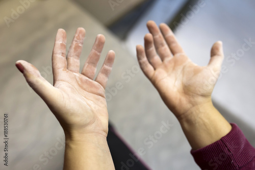 Indoor rock climbing female hands