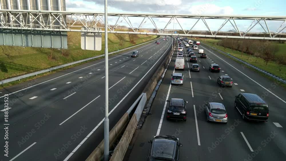 Slow commuter traffic on Dutch highway A12, traffic jam. Slow commuter traffic on Dutch highway A12, traffic jam.
