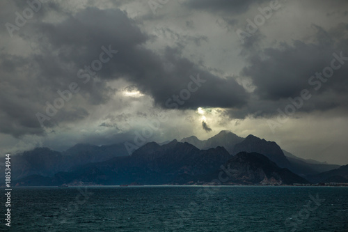 View from the Antalya waterfront to the opposite shore of the Mediterranean Sea, winter, wind, storm