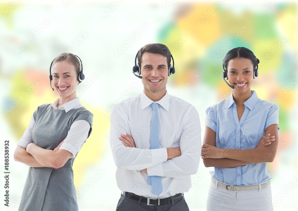 Obraz premium Travel agents wearing headsets in front of world map