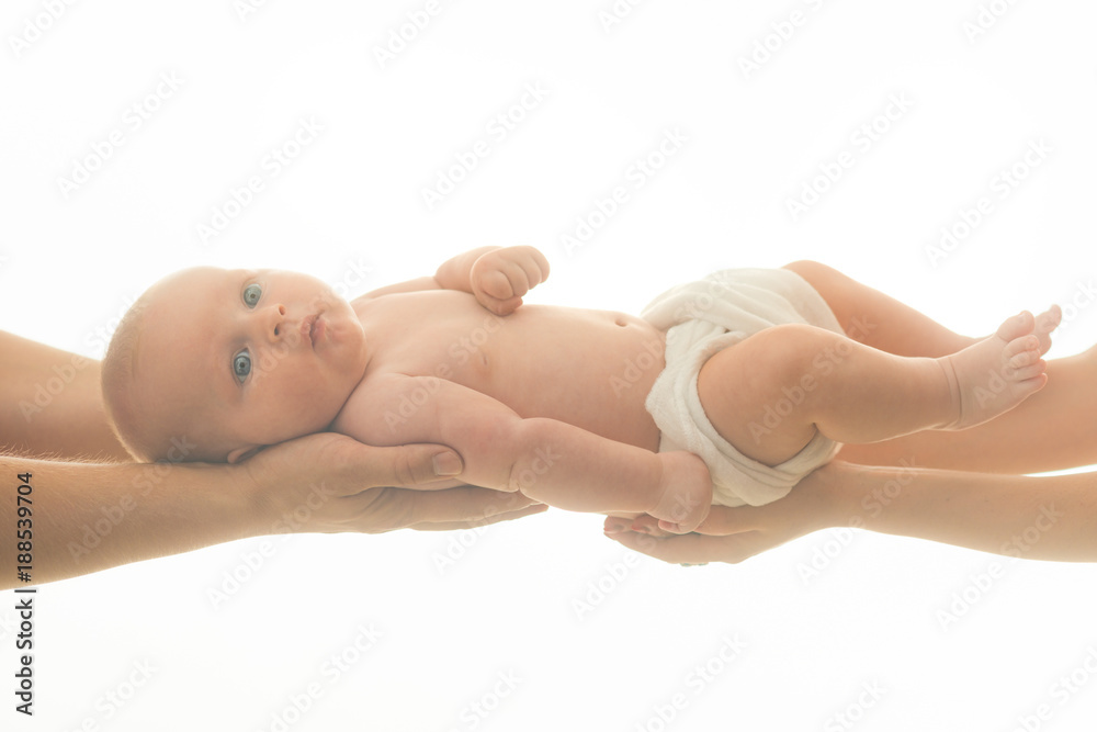 Little kid with nappy in fathers and mothers hands. Little kid with nappy in fathers and mothers hands.