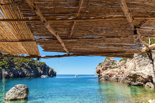 Palma de Mallorca, reed canopy on the beach overlooking the bay. the sea on Palma de Mallorca photo