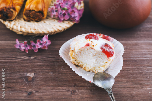 tender cake with a spoon on a wooden background. Selective focus, close up
