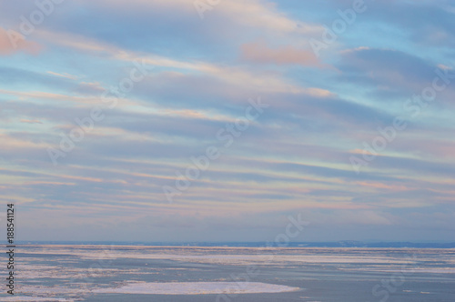 Colorful winter skies on icy waters