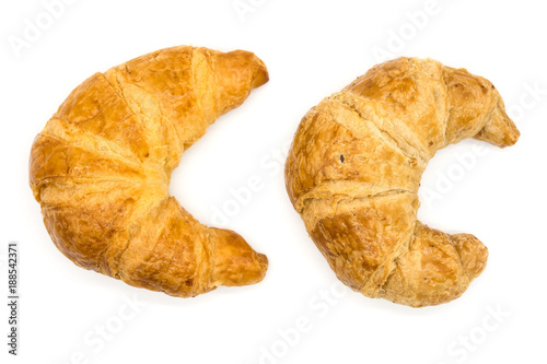 Fresh two croissant isolated on a white background closeup .