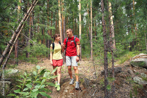 couple hikers in forest