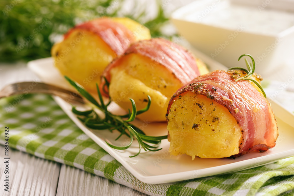 Bacon wrapped potatoes, baked with cheese. Bacon wrapped potatoes, baked with cheese.