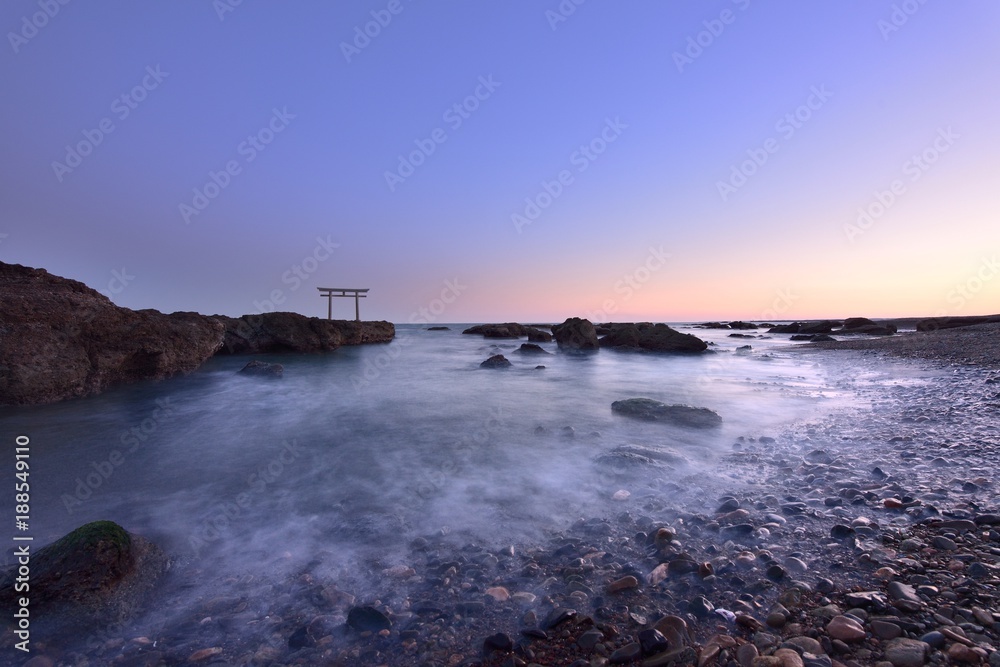 trii - gateway of shrine in the sea in the early evening by long exposure