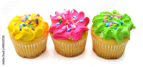 Stacked colorful cupcakes isolated over white background