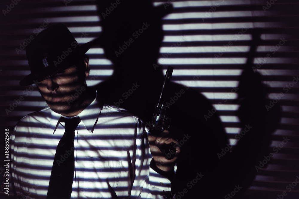 Film Noir Man With Gun Blinds Shadow. Man in white shirt, black tie and hat  standing holding gun in shadows of blinds, in film noir style. Stock Photo  | Adobe Stock