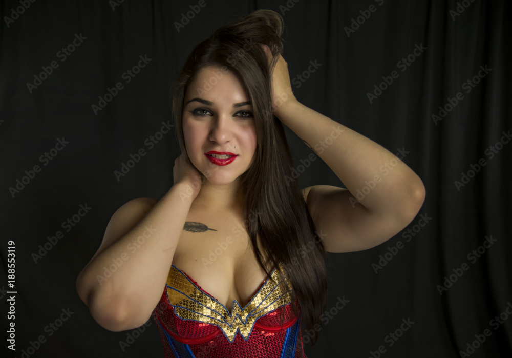 beautiful young woman in her 20's in a close-up portrait in studio beautiful young woman in her 20's in a close-up portrait in studio