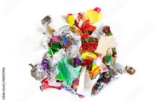 Quadro su tela A bunch of candy wrappers on a white background. Closeup