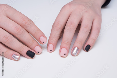 Attractive manicure on women s hands. Natural finger nails with stylish nail art.