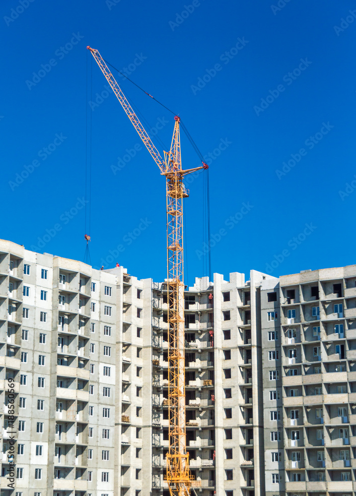 Tall cranes and multistorey housing under construction