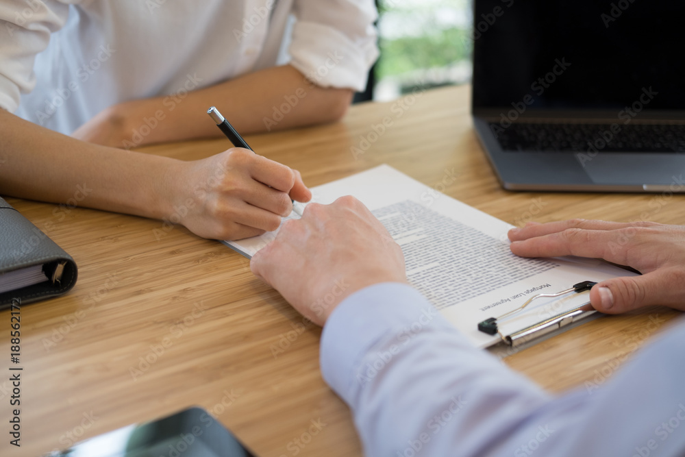 realtor talk with client.  real estate agent have a meeting with customer. sale & purchase property with signing contract document. mortgage loan agreement.