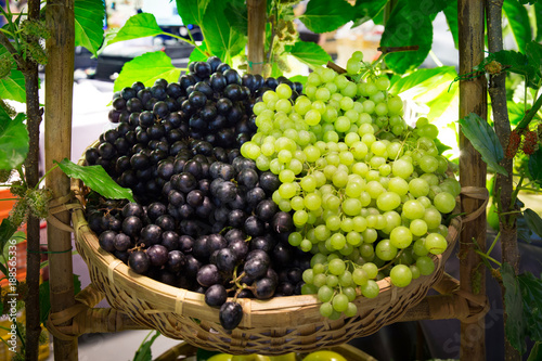Ripe grapes in wicker basket