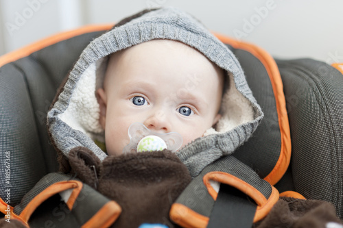 Baby lying in car seat
