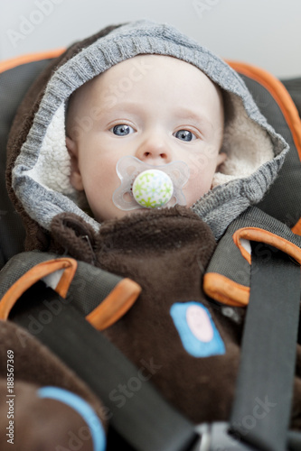 Baby lying in car seat
