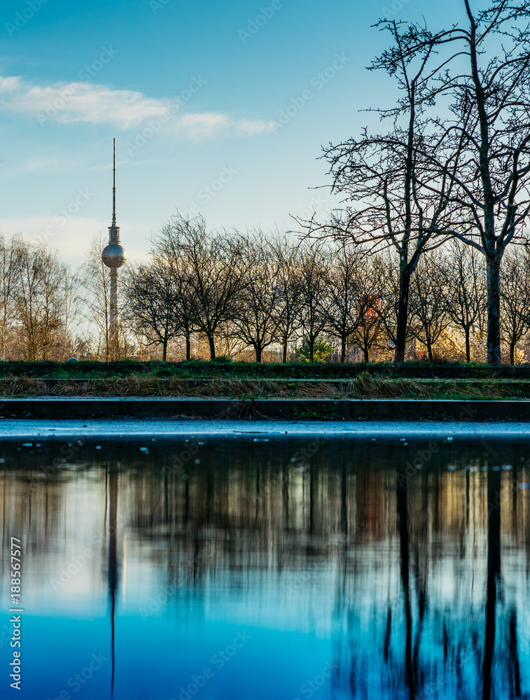 tv tower at berlin with water in the foreground
