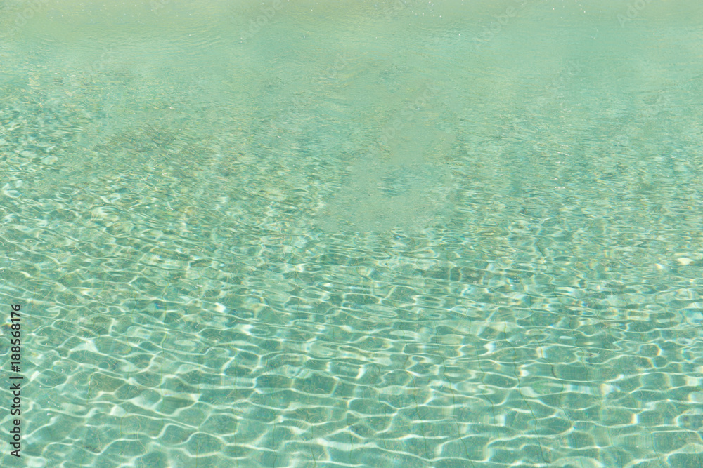 Green swimming pool rippled water detail