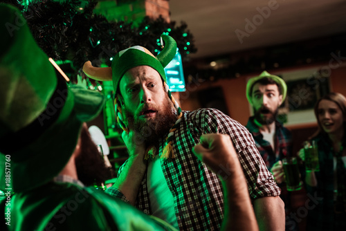 Two men fight in a bar.