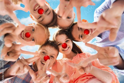 children showing peace hand sign at red nose day photo