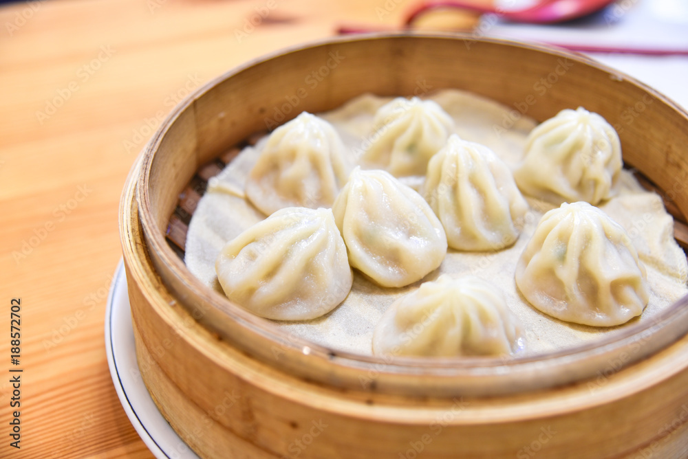 Xiao Long Bao or Chinese-Style Soup Dumplings in a Bamboo Steamer Xiao Long Bao or Chinese-Style Soup Dumplings in a Bamboo Steamer