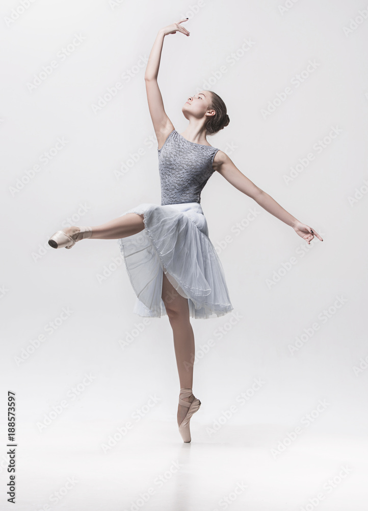 Young classical dancer isolated on white background.