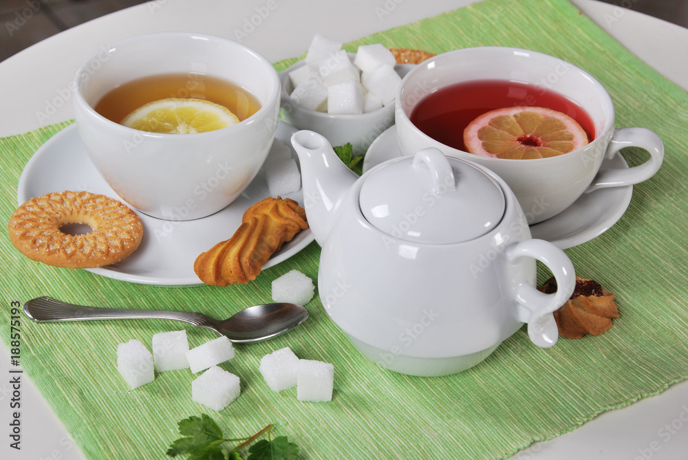 grapefruit and lemon tea with sweet cookies and sugar cubes grapefruit and lemon tea with sweet cookies and sugar cubes
