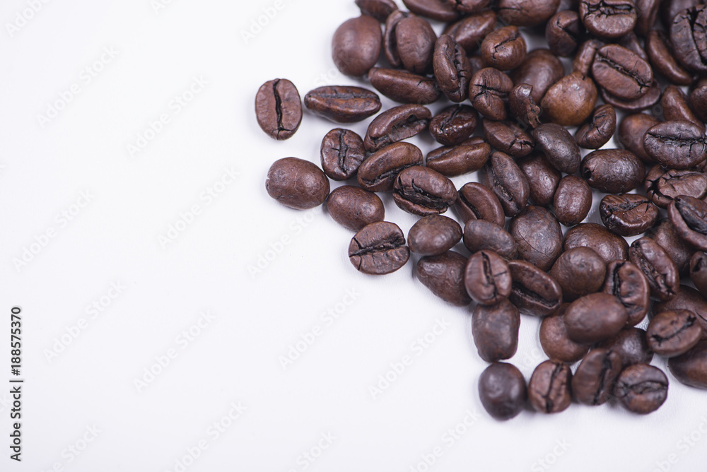 Background of of coffee beans on white background. Isolated. Background of of coffee beans on white background. Isolated.