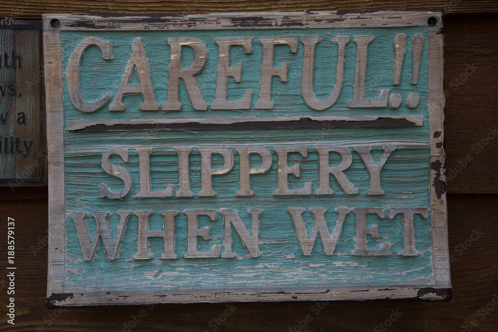 Fototapeta premium CAREFUL! SILPPERY WHEN WET SIGN