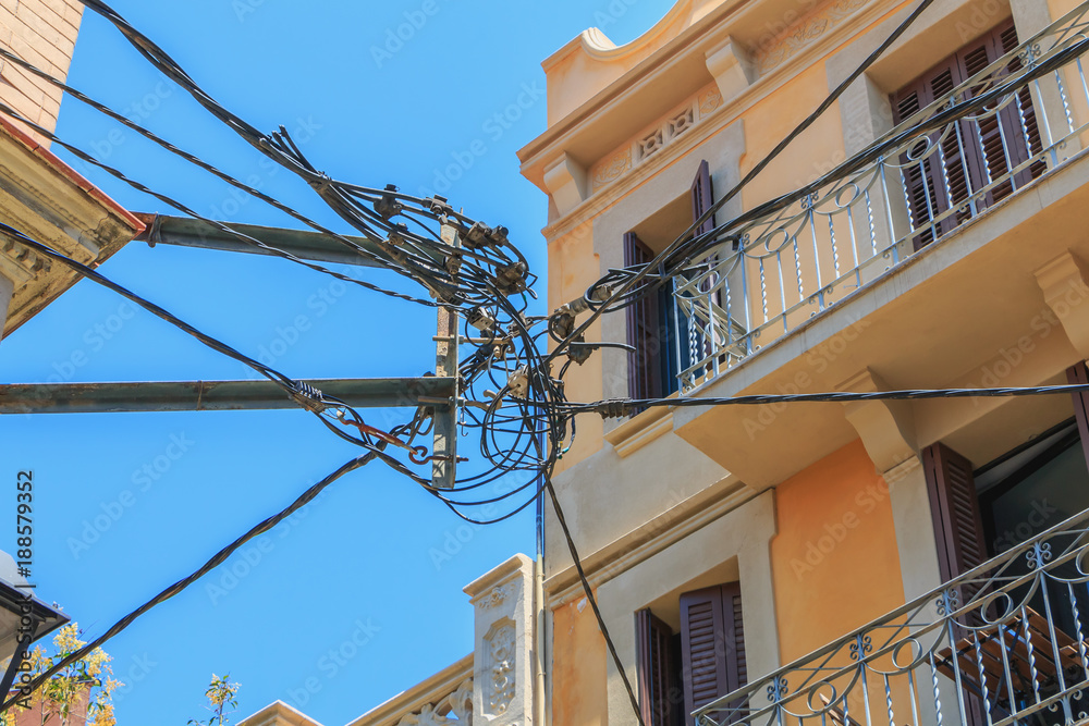 electric pylon in the city center with all its mixed cables electric pylon in the city center with all its mixed cables