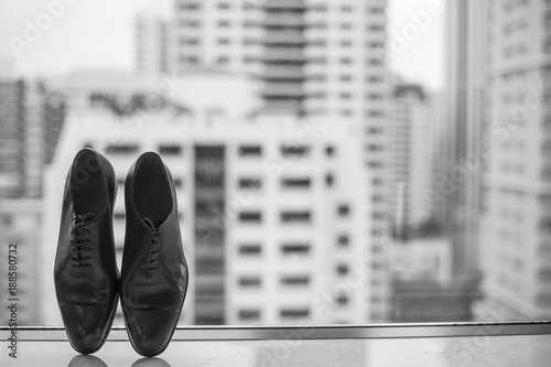  Groom shoes by the window photo