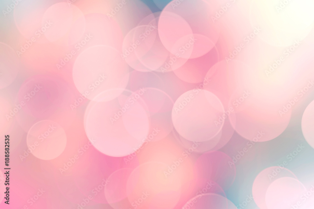 Soft pink blurred background.
