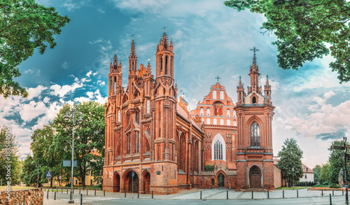 Vilnius, Lithuania. Panoramic View Of Roman Catholic Church Of St. Anne And Church Of St. Francis And St. Bernard In Old Town In Summer Sunny Day.