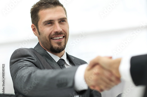 closeup .handshake of business partners on a Desk