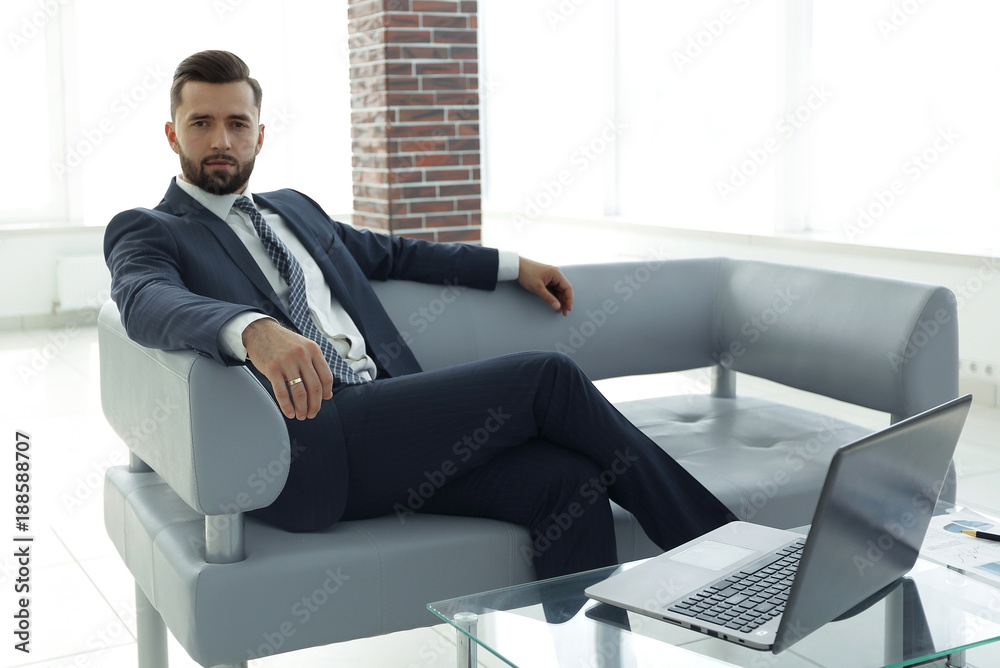 businessman sitting in the lobby of a modern office. businessman sitting in the lobby of a modern office.