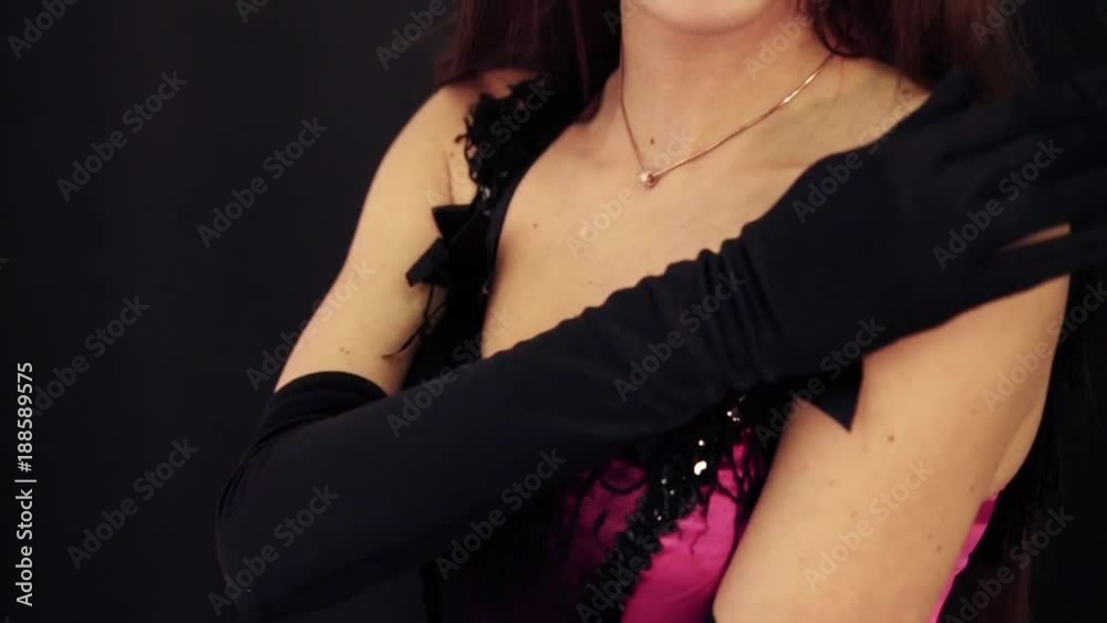 girl with gloves holds her hand on the shoulder and clothes
