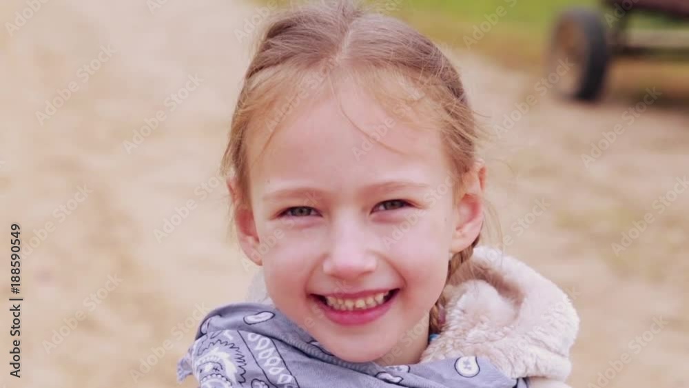 happy girl looks at the camera and smiles happy girl looks at the camera and smiles