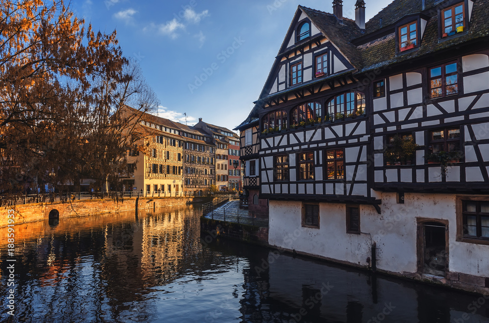 Strasbourg. Alsace, France. Traditional half-timbered houses reflected in river Ill.