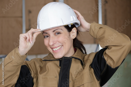 young happy female builder photo