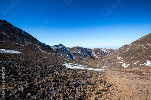 High Atlas Mountains. Walking hiking trail. Morocco, winter. Wild nature landscape of Toubcal.