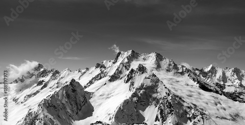 Black and white panoramic view of snow covered mountain peaks