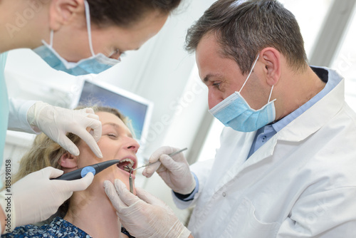 Photos patient gets a root treatment at dentist