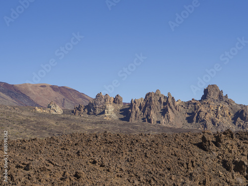 view on famous rock formation Roques de Garcia and colorful volcanic mountain and lava desert on tenerife canary island unesco protected landscape el teide national park